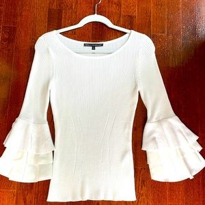 Light ivory 3/4 length sleeve with ruffles, fitted waist  summer weight fabric.
